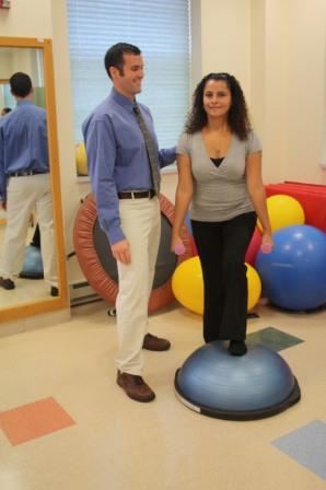 Physical therapist doing exercises with a woman